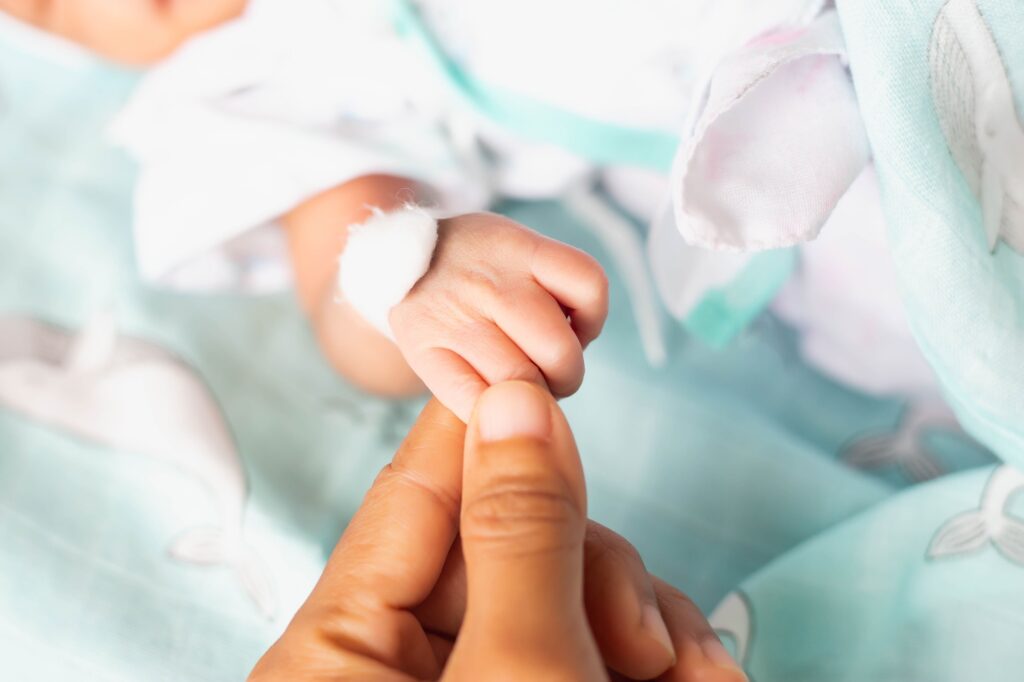 Newborn baby looking camera